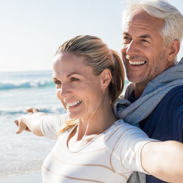 Man and woman with arms out as if flying